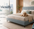 Pet-friendly upholstered bed frame with a dog in a modern Singapore bedroom, featuring scratch-resistant and easy-clean fabric